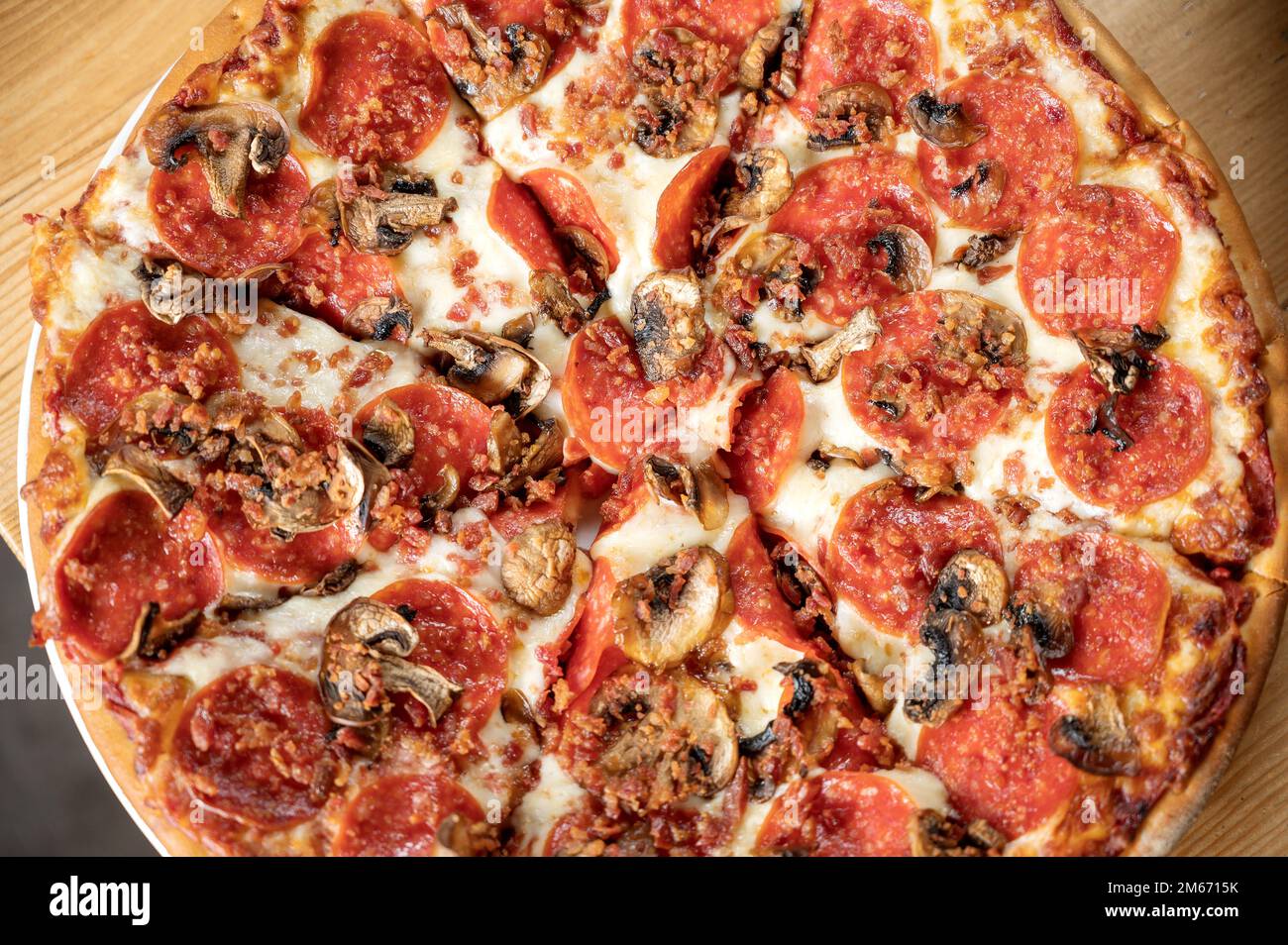 A pepperoni and mushroom pizza Stock Photo Alamy