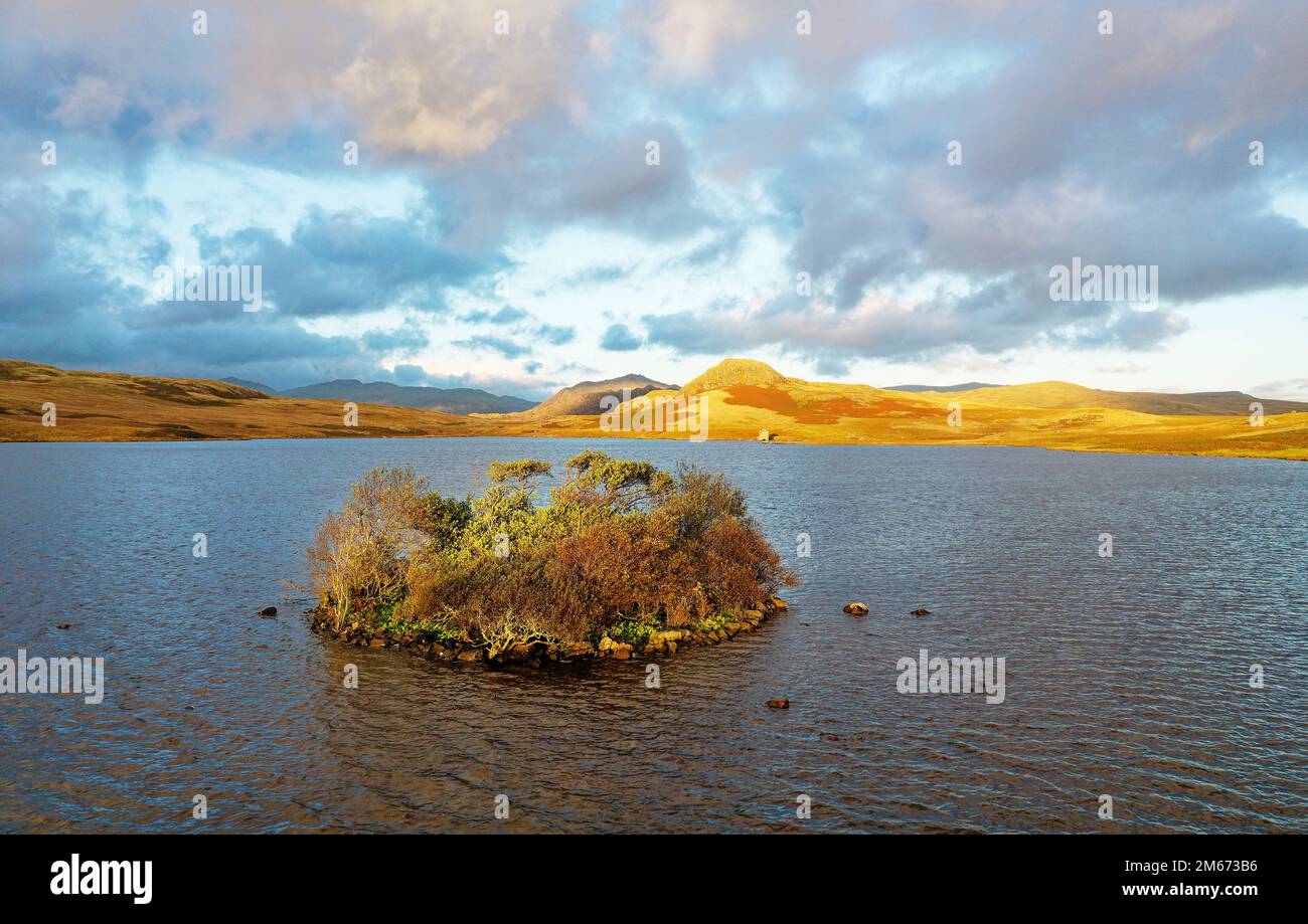 Site I have identified as a crannog, a manmade island dwelling. One feature of the prehistoric landscape at Devoke Water in the Lake District, England Stock Photo