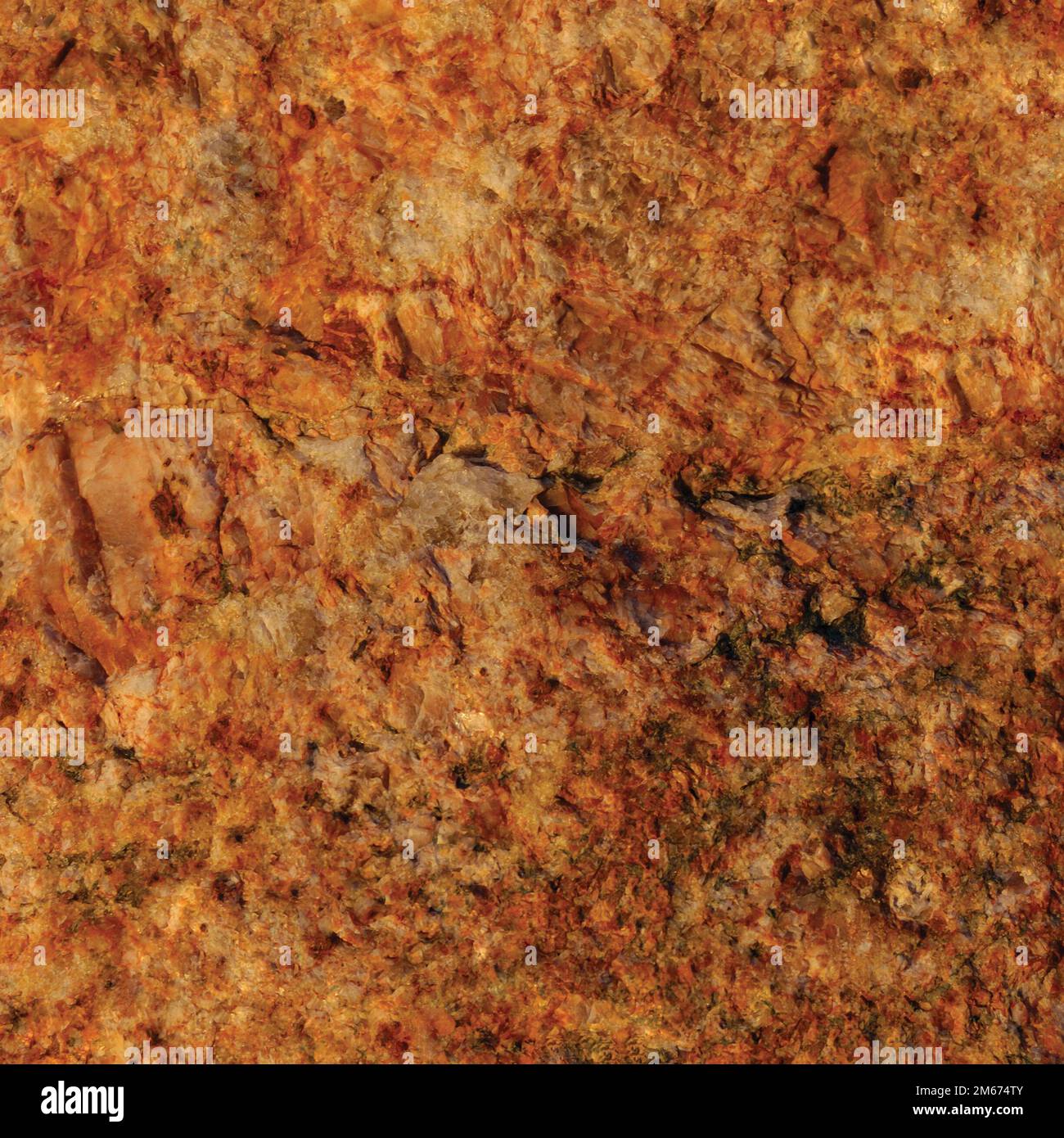 Raw pegmatite feldspar igneous rock terracotta pattern, rusty orange red golden amber yellow vertical background, coarse light crystals  texture large Stock Photo