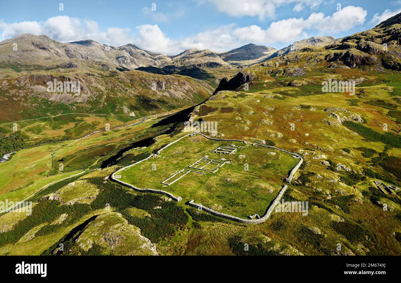 Hardknott Roman Fort Mediobogdum on Hardknott Fell. Lake District National Park, Cumbria. Aerial looking N over Upper Eskdale to Scafell and Bowfell Stock Photo