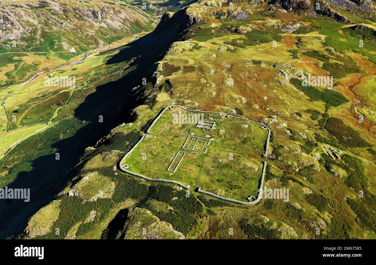 Hardknott Roman Fort Mediobogdum on Hardknott Fell. Lake District National Park, Cumbria. Aerial looking north. Terrain drops left into Upper Eskdale Stock Photo