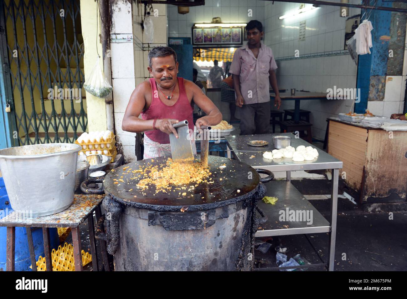 Kottu Roti preparation at a small restaurant in Madurai, Tamil Nadu, India. Stock Photo
