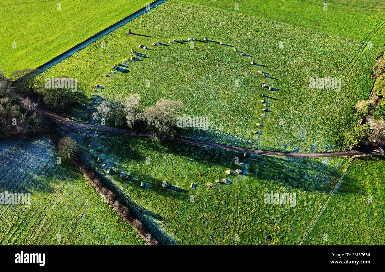 Long Meg and Her Daughters. Prehistoric Neolithic stone circle. Langwathby, Cumbria, UK. Aerial of circle and outlier stone with winter hoar frost Stock Photo