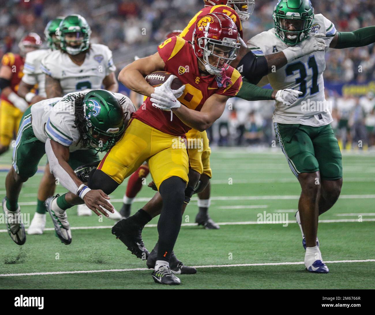 Arlington, TX, USA. 2nd Jan, 2023. USC's Michael Jackson III (9) breaks tackles en route to a touchdown during the 2023 Goodyear Cotton Bowl football game between the Tulane Green Wave and USC Trojans at AT&T Stadium in Arlington, TX. Kyle Okita/CSM/Alamy Live News Stock Photo