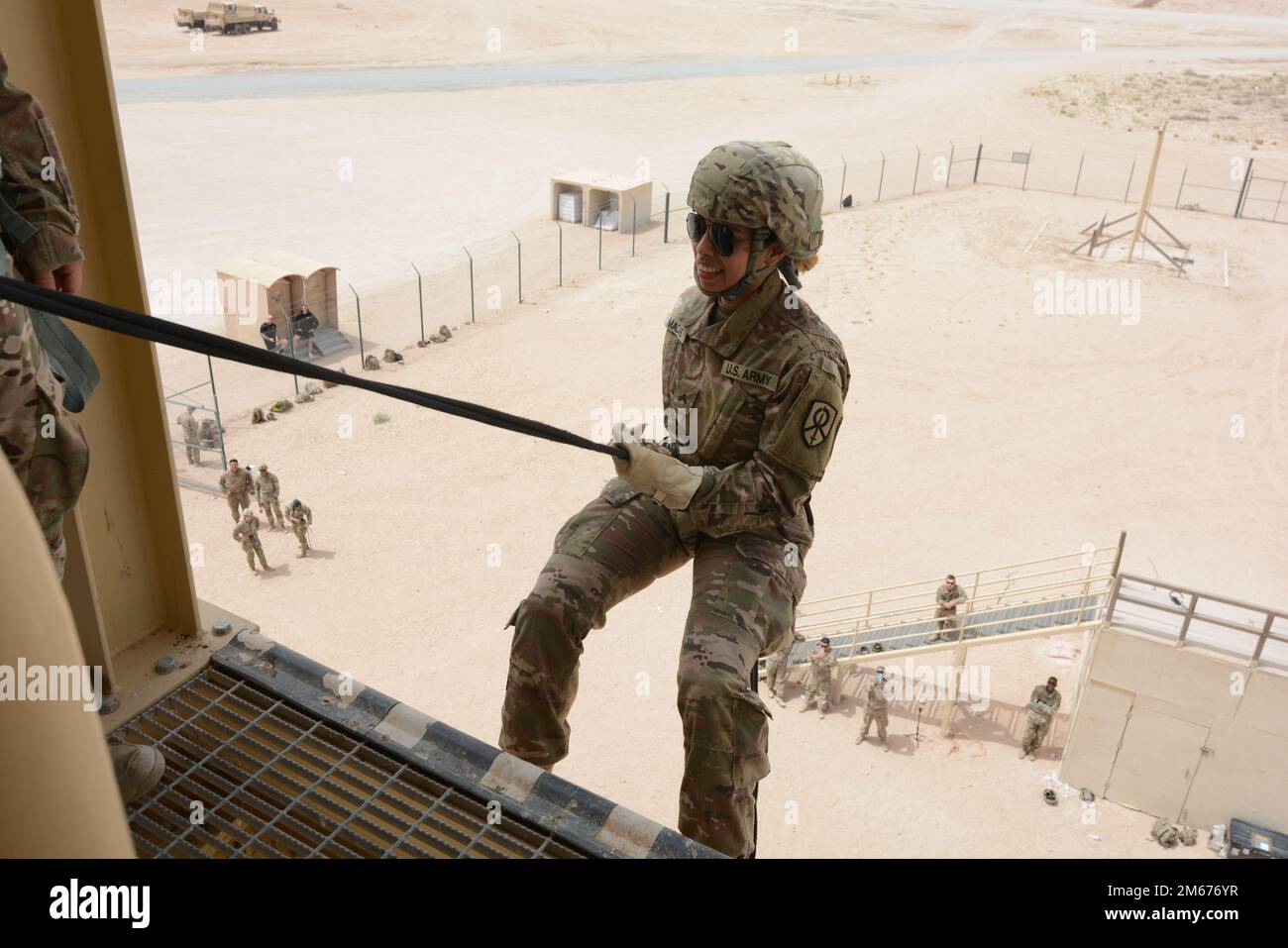 CPL Macias, Karla from the 295th Ordinance Co. Stands in L shape before doing her first bound of the tower.  Repelling Training Given on April 9th 2022 by instructors from the 295th Ordinance co. at Camp Buehring Kuwait.  (photo by SFC Delgado, Ramon) Stock Photo