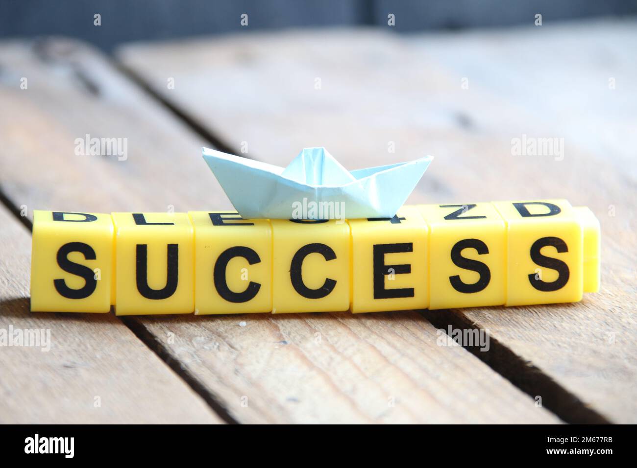 Success concept. Lettering from yellow cubes. Stock Photo