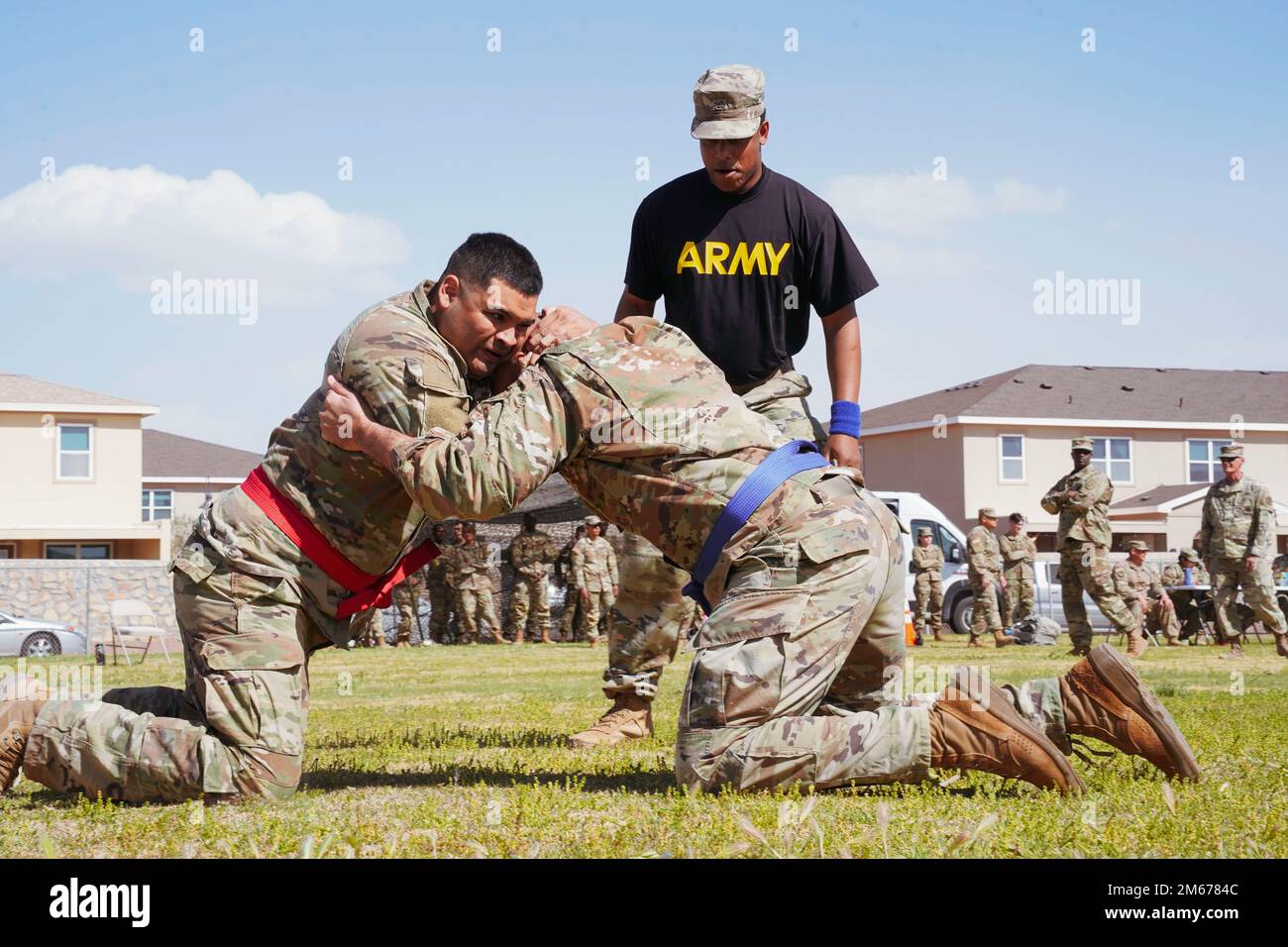 U.S. Army Staff Sgt. Jesse Ramos, assigned to the Bayne-Jones Army Community Hospital at Fort Polk, Louisiana, grabs for Sgt. 1st Class Nathaniel Williams-Griffin, assigned to the General Leonard Wood Army Community Hospital at Fort Leonard Wood, Missouri,  during the bracket-style combatives tournament of the 2022 Regional Health Command-Central Best Leader Competition in Fort Bliss, Texas, April 10, 2022.     The competition promotes esprit de corps throughout the Army while recognizing soldiers, noncommissioned officers, and officers who demonstrate commitment to the Army values and embody Stock Photo