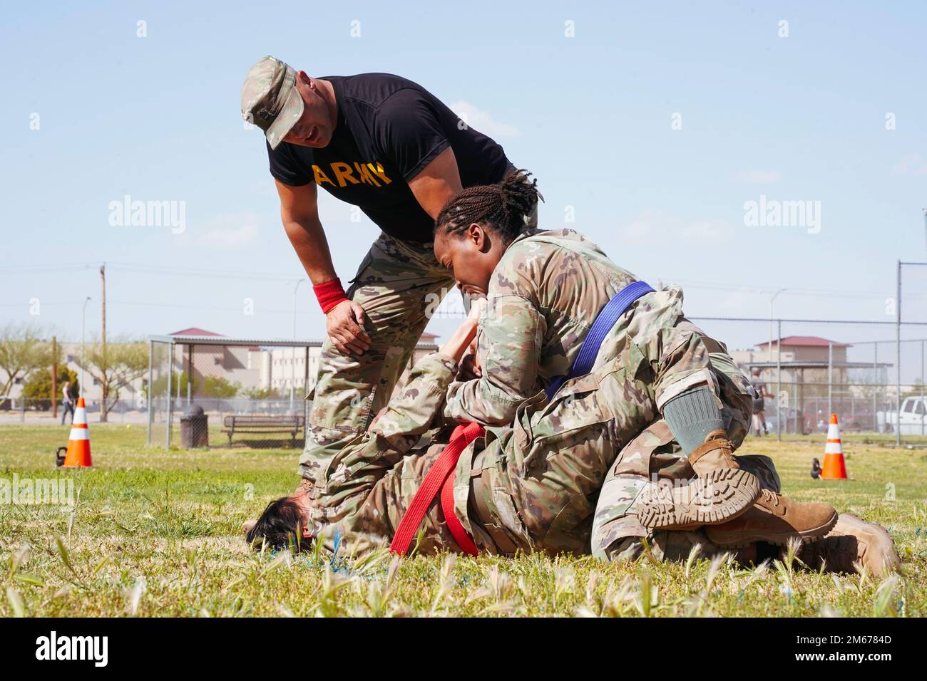 U.S. Army Capt. Ogechukwu Erinne, assigned to the Weed Army Community Hospital at Fort Irwin, California, competes with 1st Lt. Godin, assigned to the Irwin Army Community Hospital at Fort Riley, Kansas, during the bracket-style combatives tournament of the 2022 Regional Health Command-Central Best Leader Competition in Fort Bliss, Texas, April 10, 2022.     The competition promotes esprit de corps throughout the Army while recognizing soldiers, noncommissioned officers, and officers who demonstrate commitment to the Army values and embody the warrior ethos. The competition challenges the Army Stock Photo