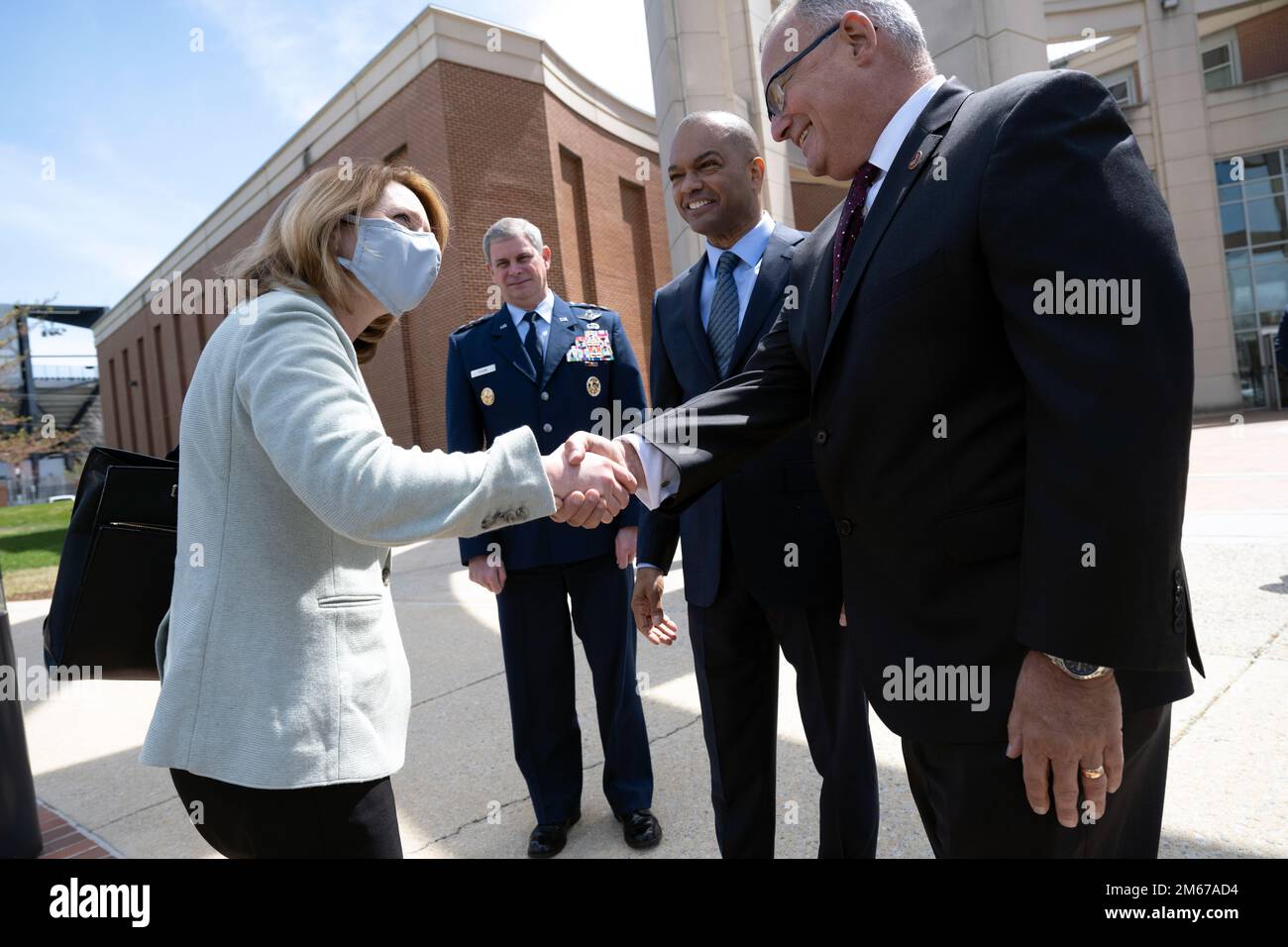 Deputy Secretary of Defense Kathleen H. Hicks shakes hands with the chief operating officer of Business Executives for National Defense (BENS), Guy “Tom” Cosentino, before an industry discussion at the National Defense University, Washington, D.C., April 11, 2022. Also pictured are Air Force Lt. Gen. Michael T. Plehn, president of the National Defense University; and Gregory S. Nixon, BENS Board of Directors. (DoD photo by Lisa Ferdinando) Stock Photo