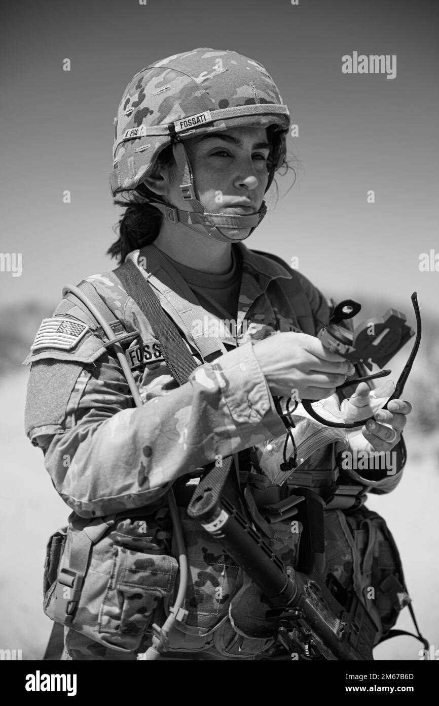 U.S. Army 1st Lt. Sandrine Fosatti, a dietitian at William Beaumont Army Medical Center, uses her compass to find her next point while participating in the Land Navigation Assessment as part of the Regional Health Command-Central Best Leader Competition in Fort Bliss, Texas, on April 11, 2022. The competition promotes esprit de corps throughout the Army while recognizing Soldiers, noncommissioned officers, and officers that demonstrate commitment to the Army values and embody the Warrior Ethos. Stock Photo