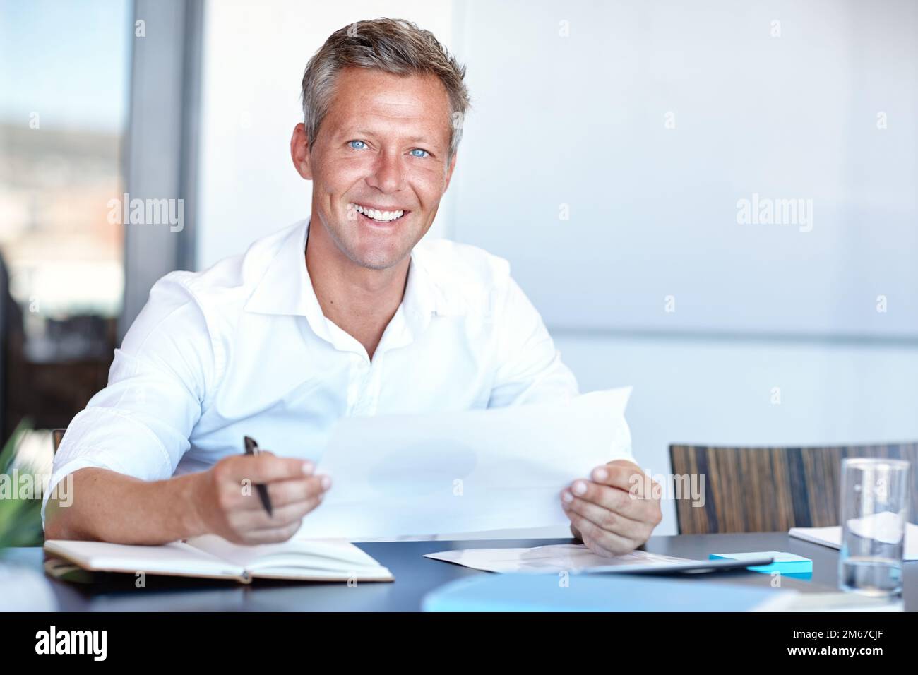 Success is all about prioritizing. a handsome businessman going through ...