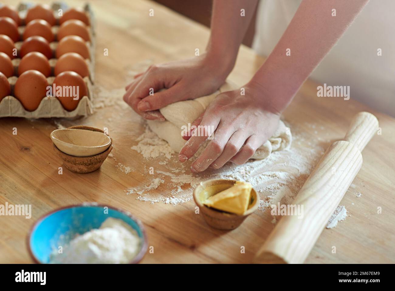 Home is where the dough is. a set of hands kneading dough Stock Photo ...