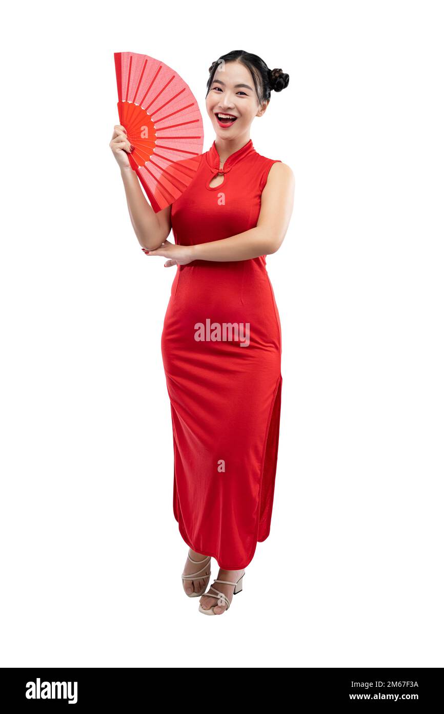 Asian Chinese woman in a cheongsam dress holding a red Chinese fan ...