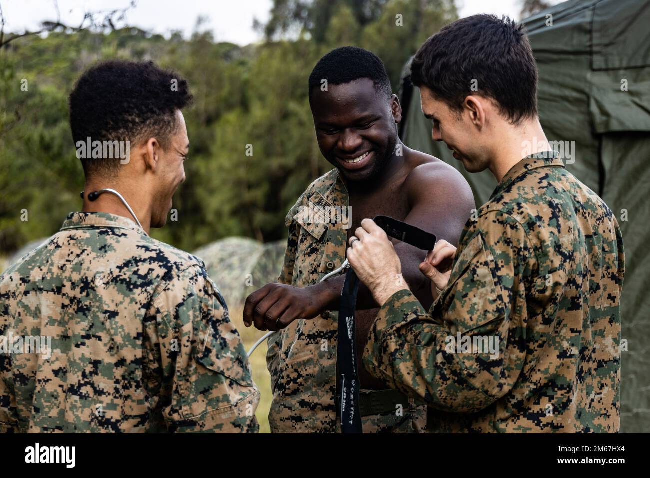 U.S. Navy Petty Officer 2nd Class Joseph Nichols, right, a 