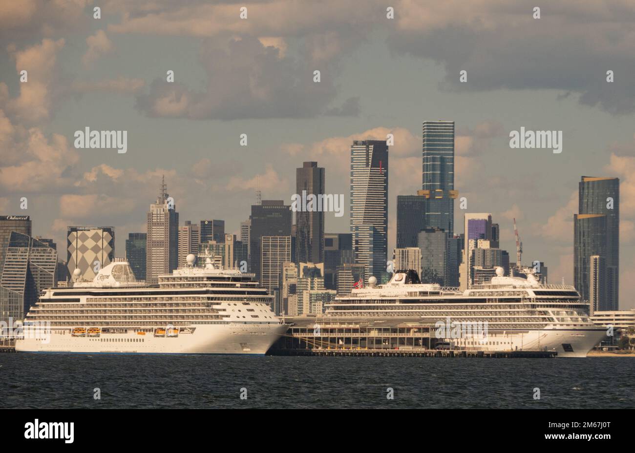 Cruise ships docked at Station Pier in Port Melbourne with the Melbourne city skyline in the background . Stock Photo
