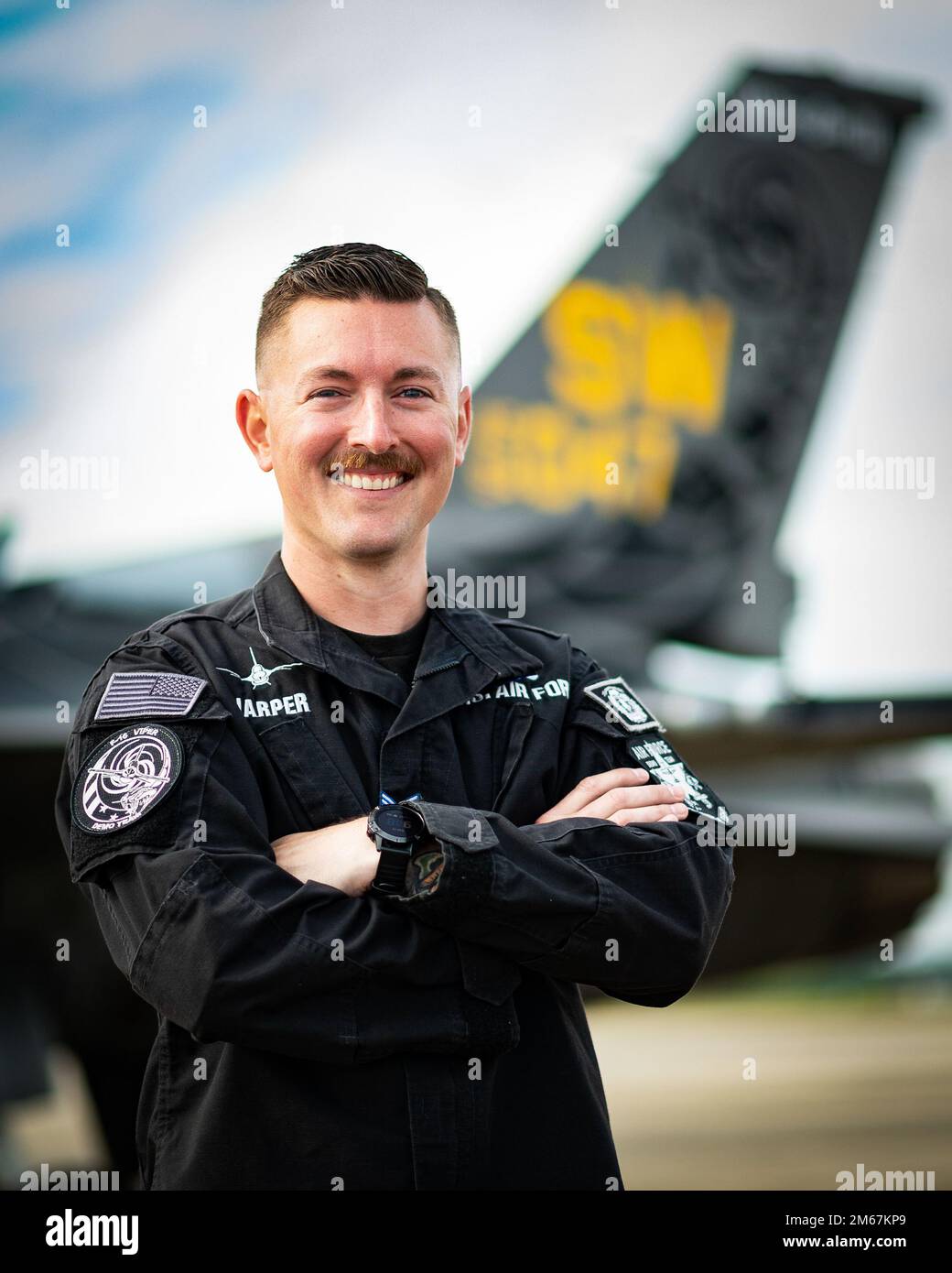 U.S. Air Force Staff Sgt. Robert Harper, F-16 Viper Demonstration Team (VDT) dedicated crew chief, smiles for photo at Shaw Air Force Base, South Carolina, April 13, 2022. The VDT travels to roughly 20 air shows across the United States each year where they engage with local media and members of the community in which they are performing. Stock Photo