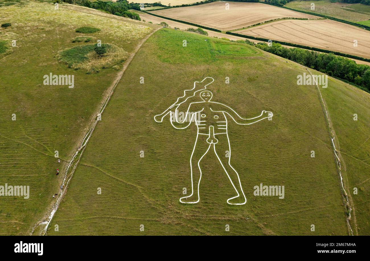 Cerne Abbas Giant, Dorset. Ancient male phallic chalk hill figure. 55 metres high. Above head is Iron Age earthwork called the Trendle or frying pan Stock Photo