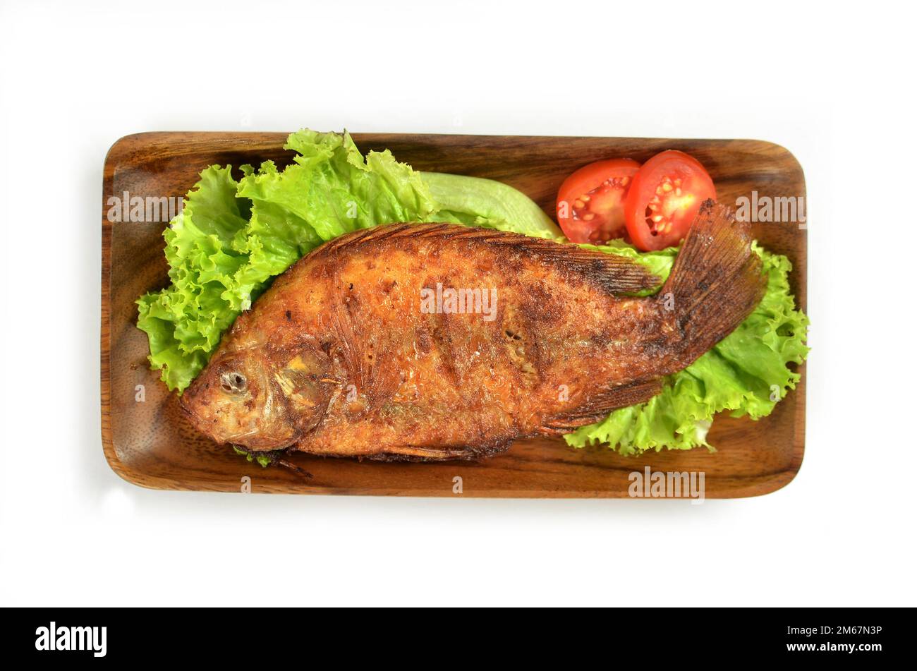 Popular Indonesian dish of fried fish isolated on white background. Stock Photo