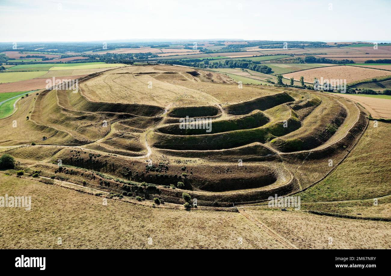 Maiden Castle, Dorset, England, dates from 4000 BC causewayed enclosure. View east across ramparts and ditches of Iron Age hillfort west entrance Stock Photo