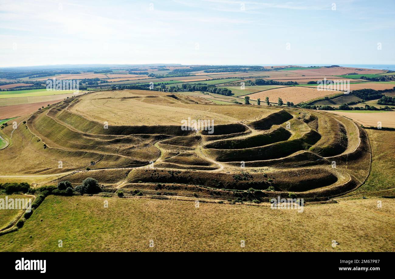 Maiden Castle, Dorset, England, dates from 4000 BC causewayed enclosure. View east across ramparts and ditches of Iron Age hillfort west entrance Stock Photo
