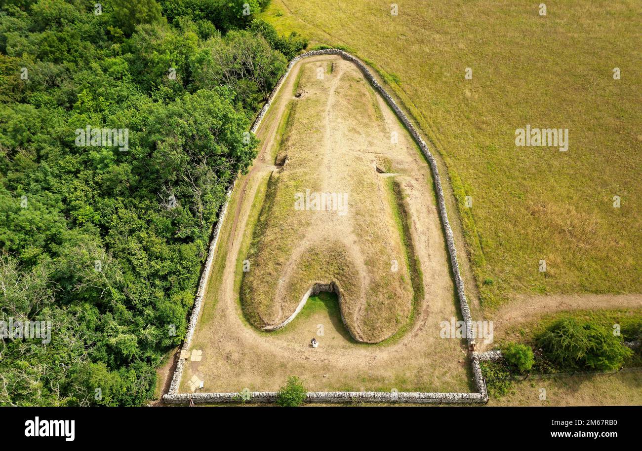 Belas Knap 5000 year Neolithic chambered long barrow near Winchcombe, UK. Cotswold Severn Cairn type. Showing burial chamber entrances and forecourt Stock Photo