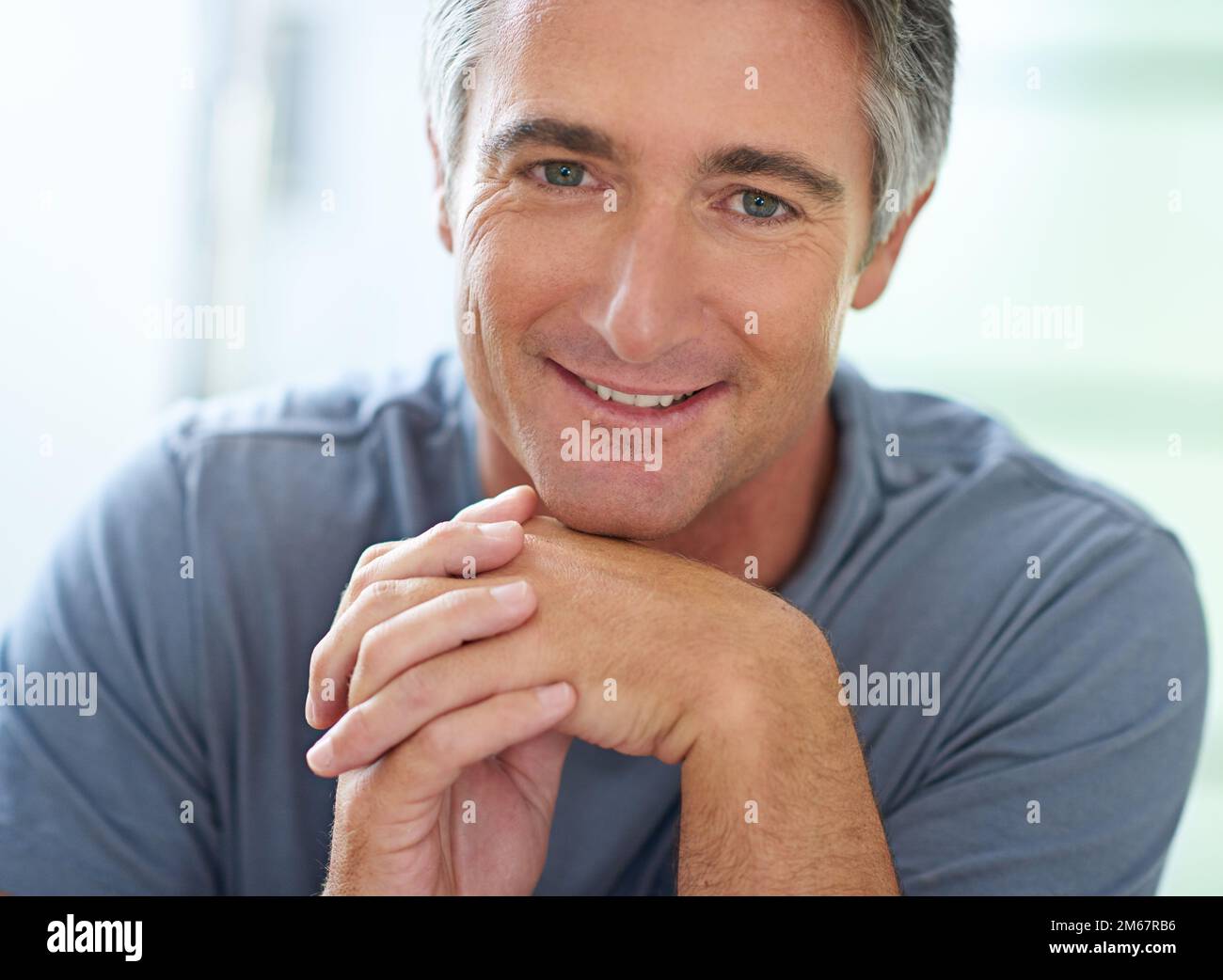 Hes easygoing about eveything. Portrait of a handsome mature man relaxing at home. Stock Photo