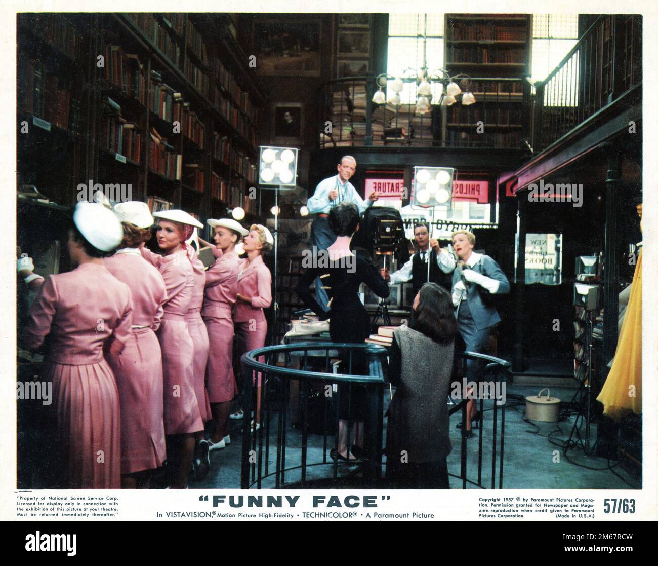 FRED ASTAIRE and KAY THOMPSON with Fashion Models in Bookshop in FUNNY FACE 1957 director STANLEY DONEN costume design Edith Head producer Roger Edens Paramount Pictures Stock Photo