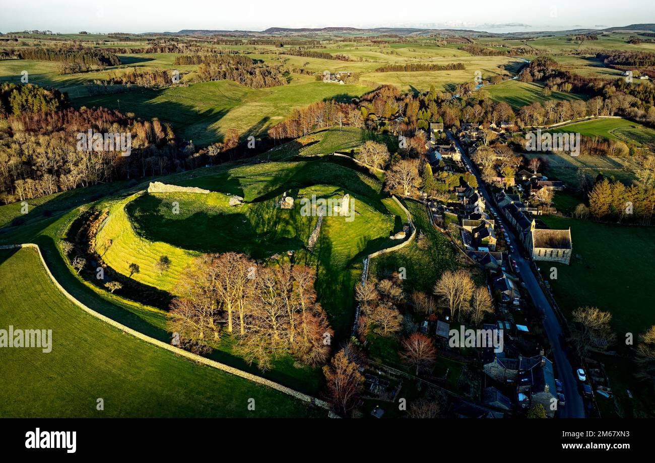 Harbottle 12th C. Norman castle, Northumberland, showing well preserved motte and bailey and more recent shell keep. Aerial Stock Photo