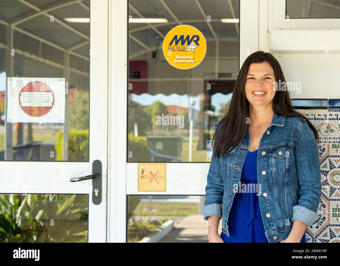 NAVAL STATION ROTA, Spain (April 14, 2022)  Amy Hutyra, marketing and sponsorship director for Fleet and Family Readiness (FFR) and Morale, Welfare and Recreation (MWR), poses for a photo in front of the marketing office, April 14, 2022. Stock Photo