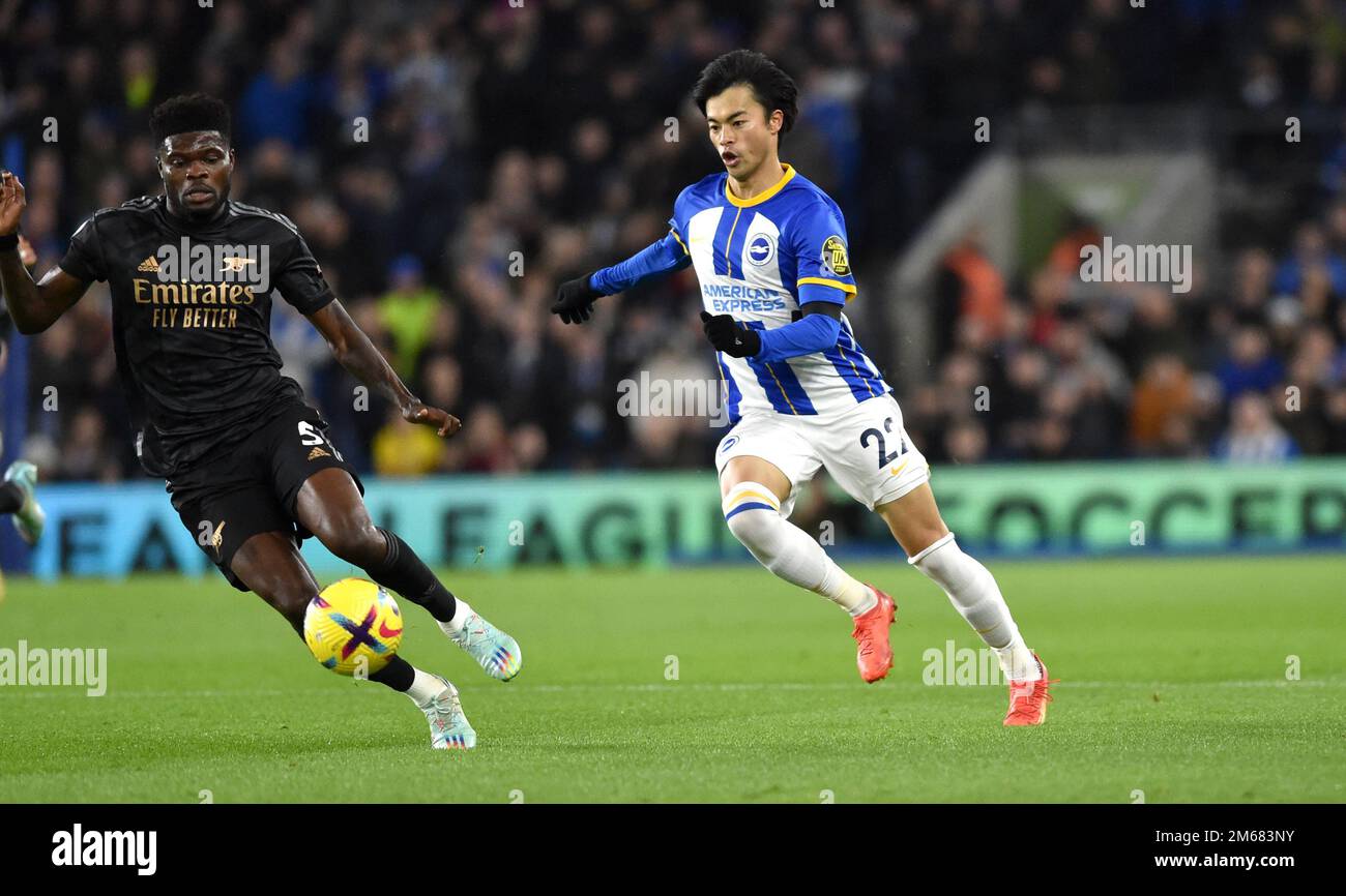 Kaoru Mitoma of Brighton (right) takes on Thomas of Arsenal during the Premier League match between Brighton & Hove Albion and  Arsenal at The American Express Community Stadium , Brighton , UK - 31st December 2022 Editorial use only. No merchandising. For Football images FA and Premier League restrictions apply inc. no internet/mobile usage without FAPL license - for details contact Football Dataco Stock Photo