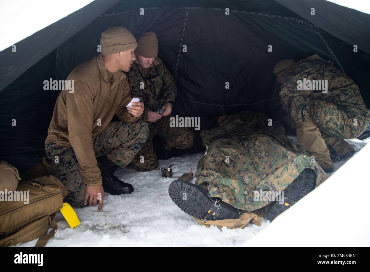 U.S. Marines, with the 22nd Marine Expeditionary Unit, wait for further medical support during casualty evacuation drills, in Setermoen, Norway, April 15, 2022. U.S. Marines and Sailors are training in Norway to strengthen relationships between NATO and allied forces. Stock Photo