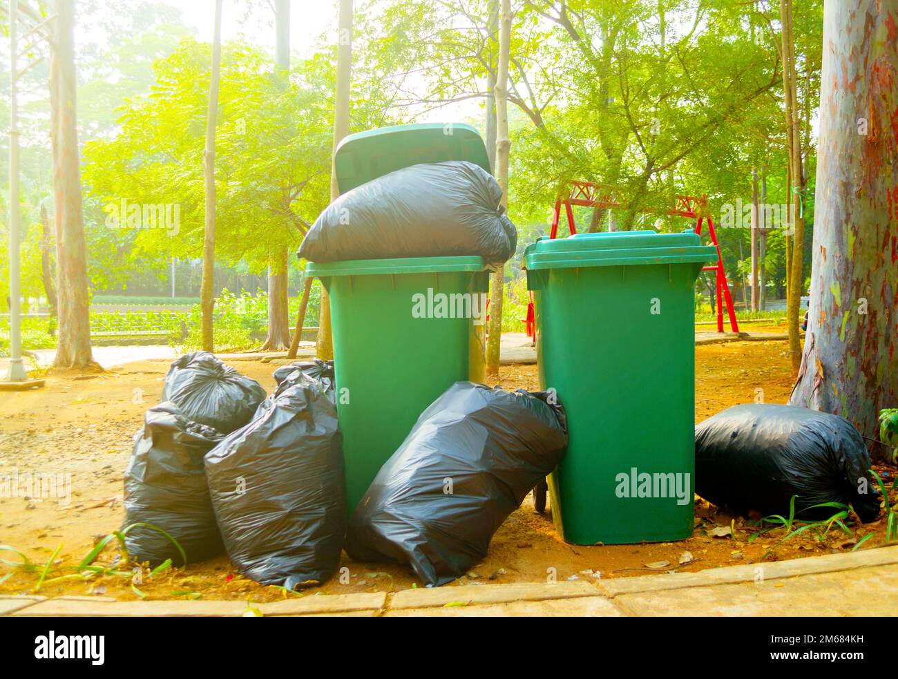 overflowing green wheelie bin Stock Photo Alamy
