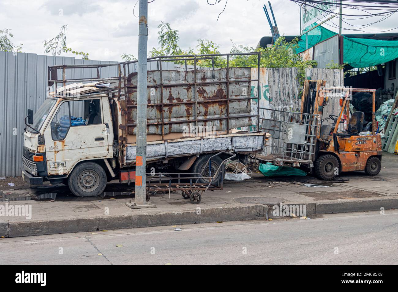 SAMUT PRAKAN, THAILAND, NOV 14 2022, An old truck is parked on the sidewalk Stock Photo