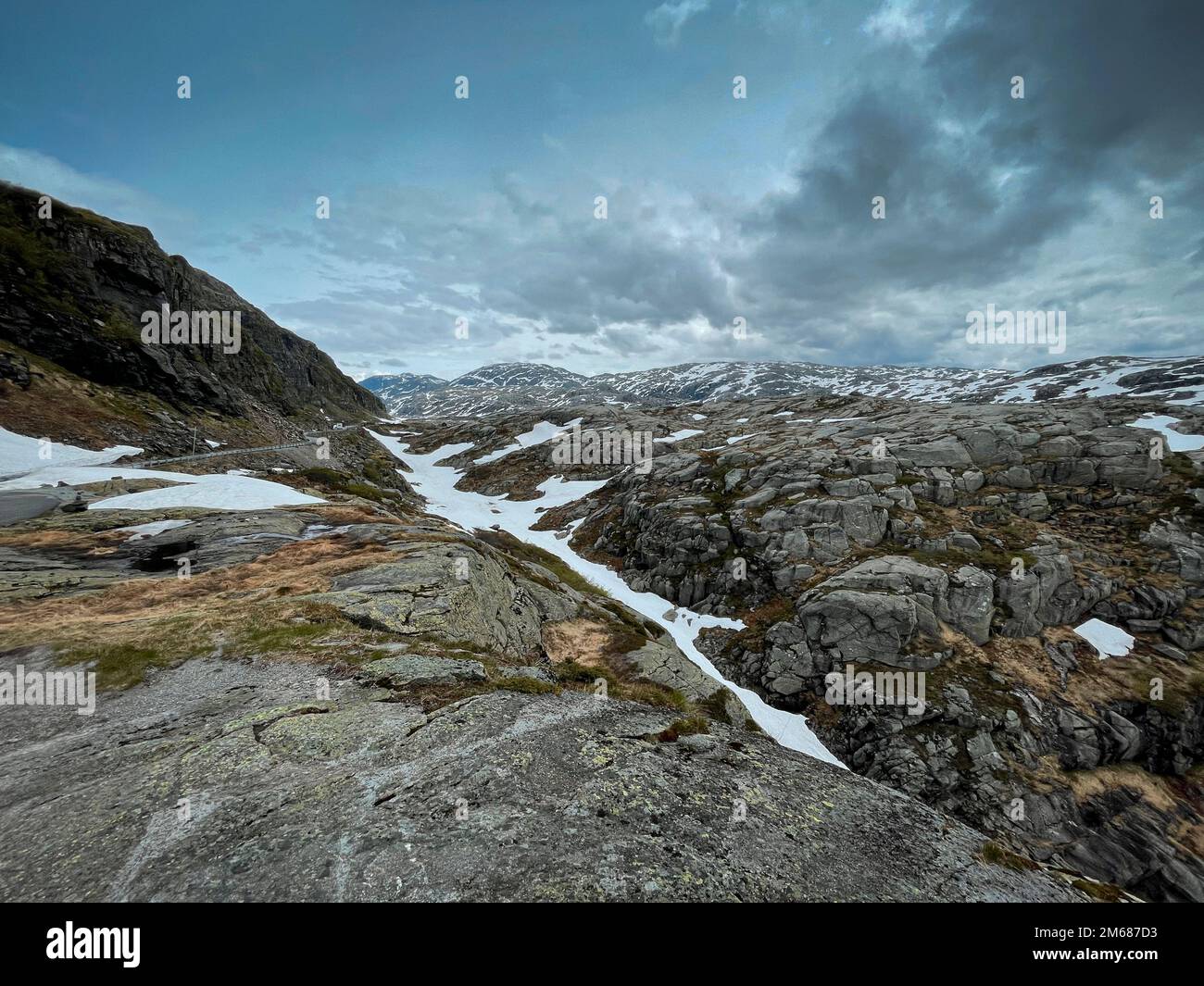 An aerial shot of snowy dry scenery on the road 520 between Sauda and ...