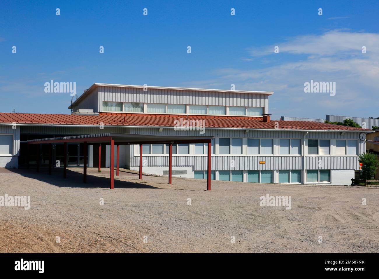 School building and empty yard at Armfelt School complex in Halikko, Finland on a sunny day of August. Stock Photo