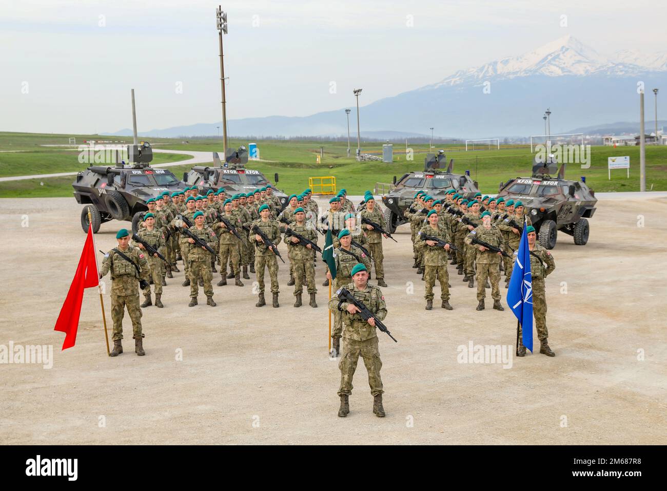 CAMP BONDSTEEL, Kosovo – Turkish Armed Forces Soldiers with the Maneuver Battalion, Regional Command East, Kosovo Force, stand in formation for a photo on Camp Bondsteel, Kosovo, April 16, 2022. The Turkish contingent is working alongside NATO partners to support the mission of sustaining a safe and secure environment and freedom of movement in Kosovo. Stock Photo