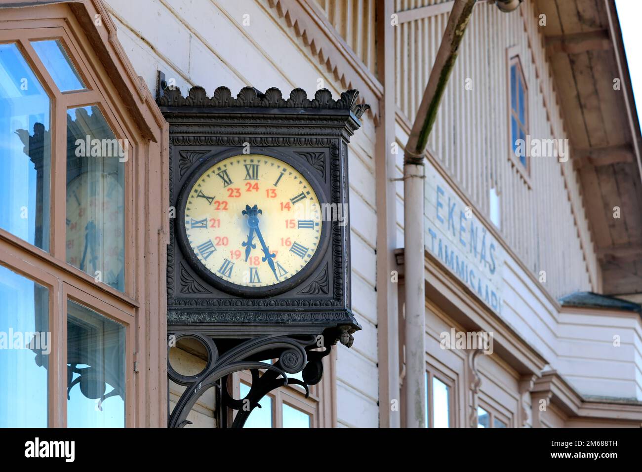 Old, nostalgic outdoor wall clock at Tammisaari - Ekenäs railway station in South of Finland. Stock Photo