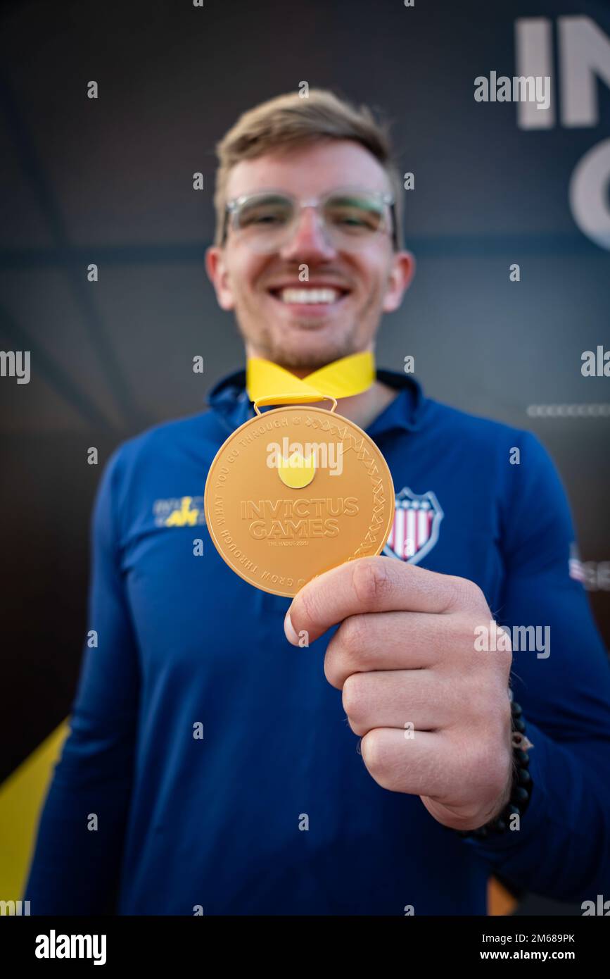 Retired U.S. Marine Corps Cpl. Andrew Holliday, shows off his gold