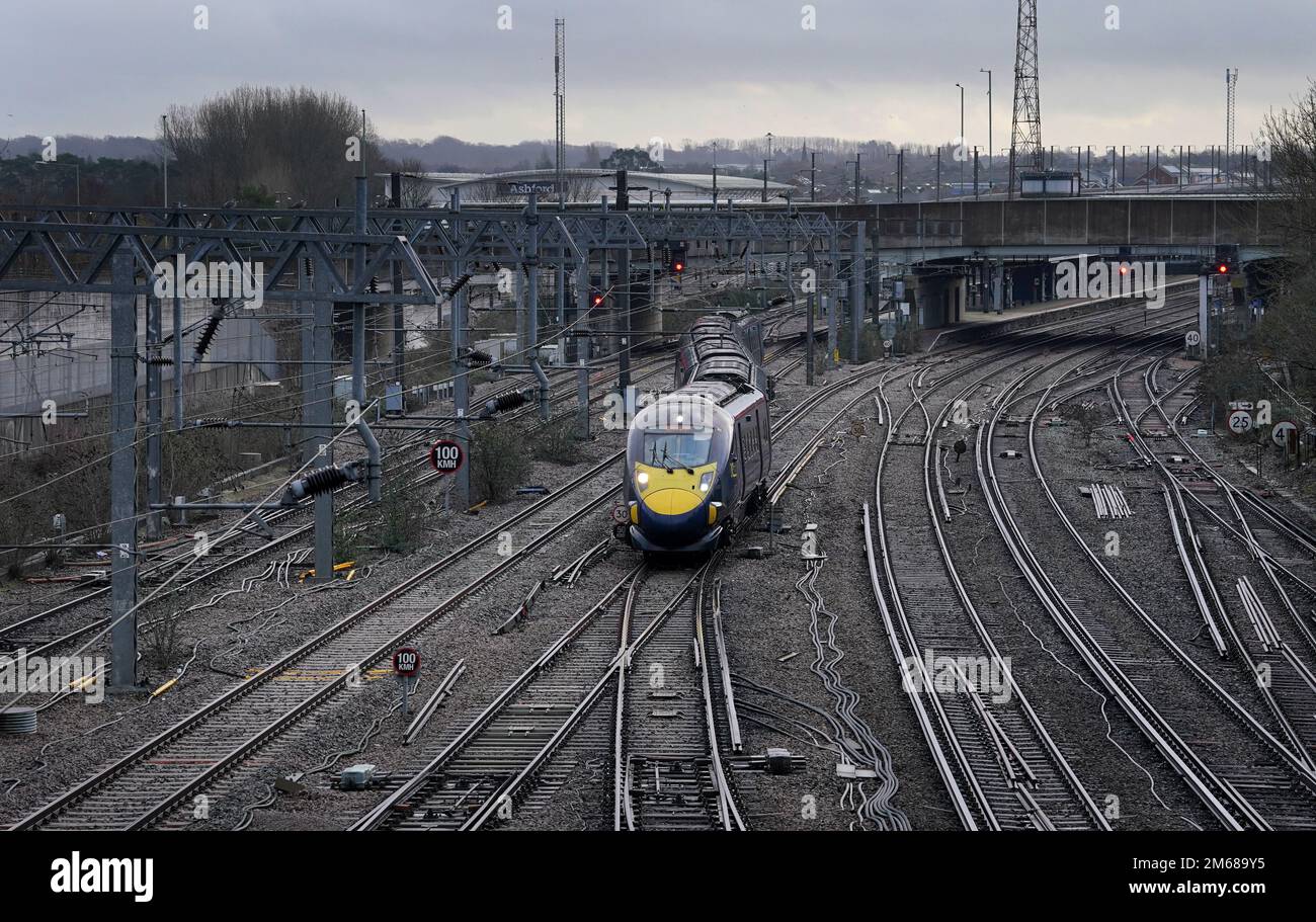 A Southeastern High Speed Train Leaves Ashford Station In Kent Under A a-southeastern-high-speed-train-leaves-ashford-station-in-kent-under-a