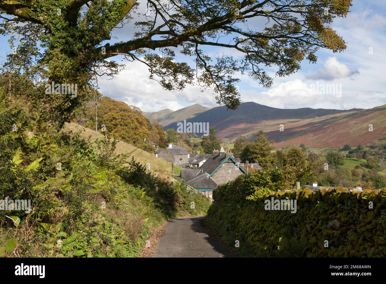 A minor road leading into the village of Troutbeck in the Lake District Stock Photo