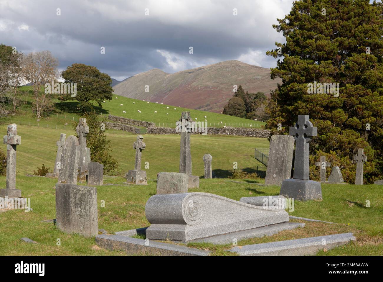Graves in the yard of Jesus Church which is an Anglican parish church in the village of Troutbeck in the Lake District Stock Photo