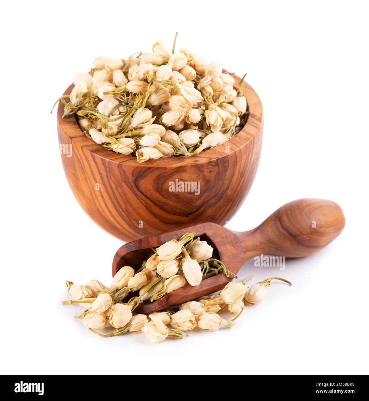 Dry jasmine flowers in wooden bowl and spoon, isolated on white