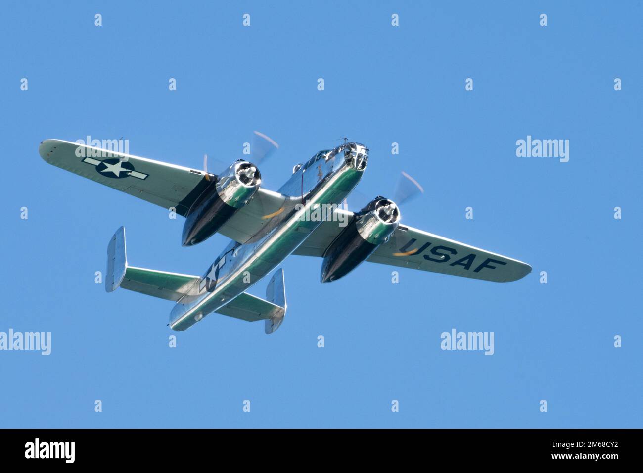 A B-25 medium bomber flies over during The Doolittle Raiders’ 80th Anniversary ceremony, April 18, 2022 at Okaloosa Island. U.S. Air Force Lt. Gen. Jim Slife, commander of Air Force Special Operations Command and U.S. Air Force Lt. Gen. Brad Webb, commander of Air Education and Training Command (AETC), conducted an aerial review in honor of the members of the Doolittle Raiders. Stock Photo