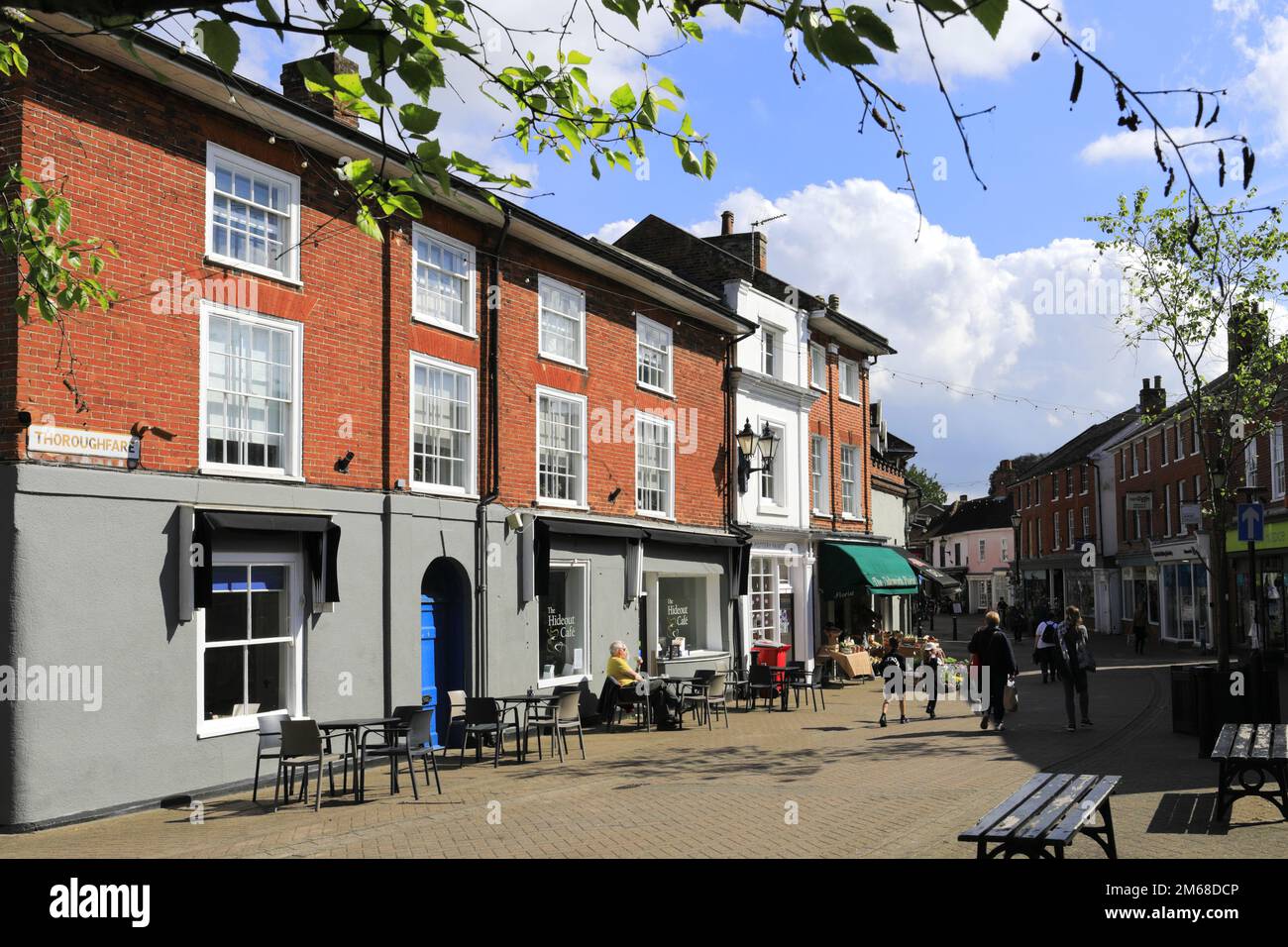Shops and cafes in the Thoroughfare street, Halesworth market town, Suffolk, England, UK Stock Photo
