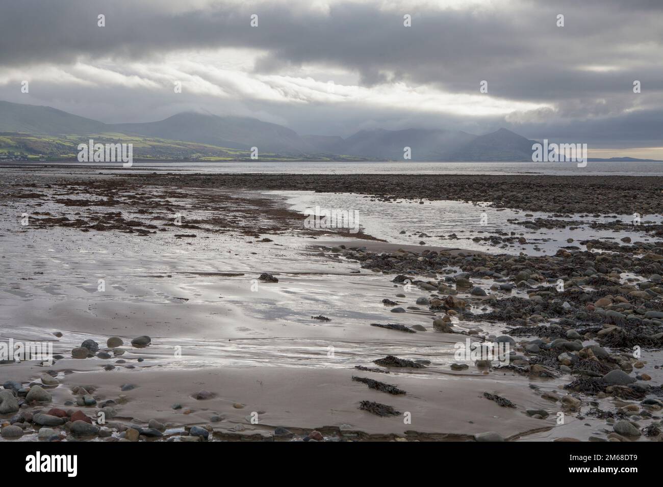 The view to the Llyn Peninsula from Dinas Dinlle beach in Llandwrog, Wales Stock Photo