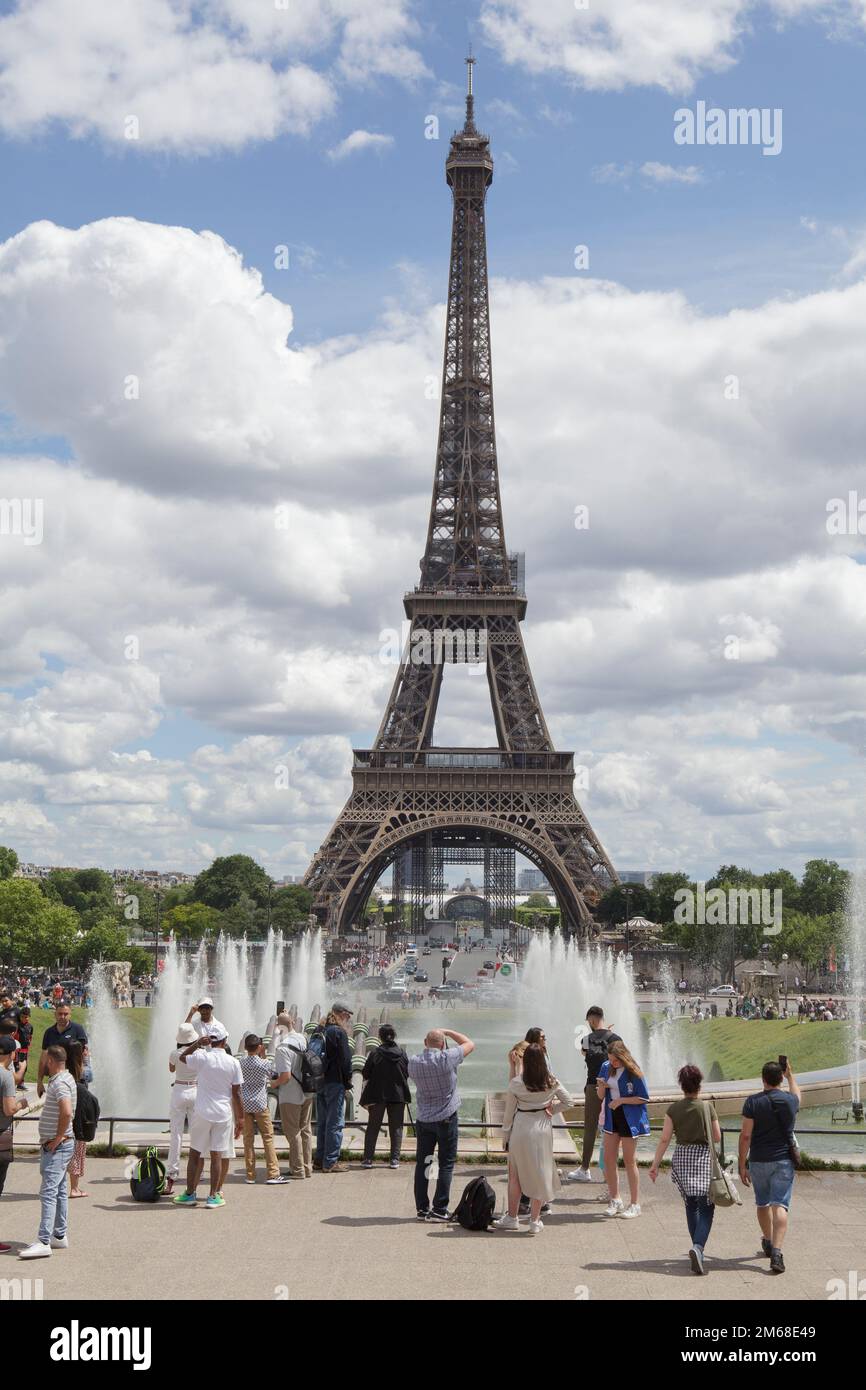 Tourists at the Warsaw Fountains in Jardins du Trocadero, overlooking the Eiffel Tower. Paris Stock Photo