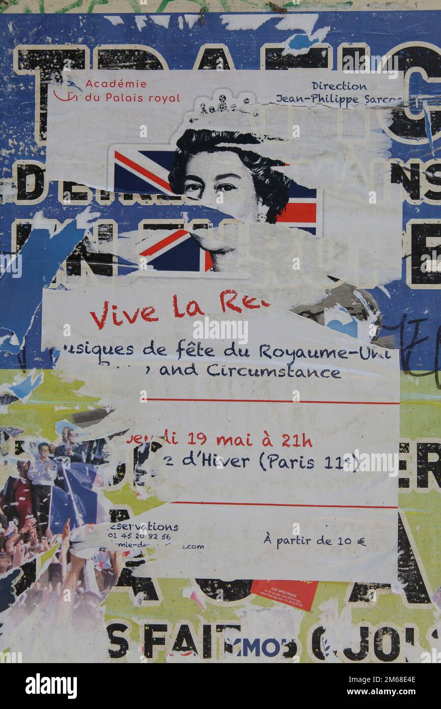 Torn posters in Paris saying Vive La Reine which translates to Long Live the Queen Stock Photo