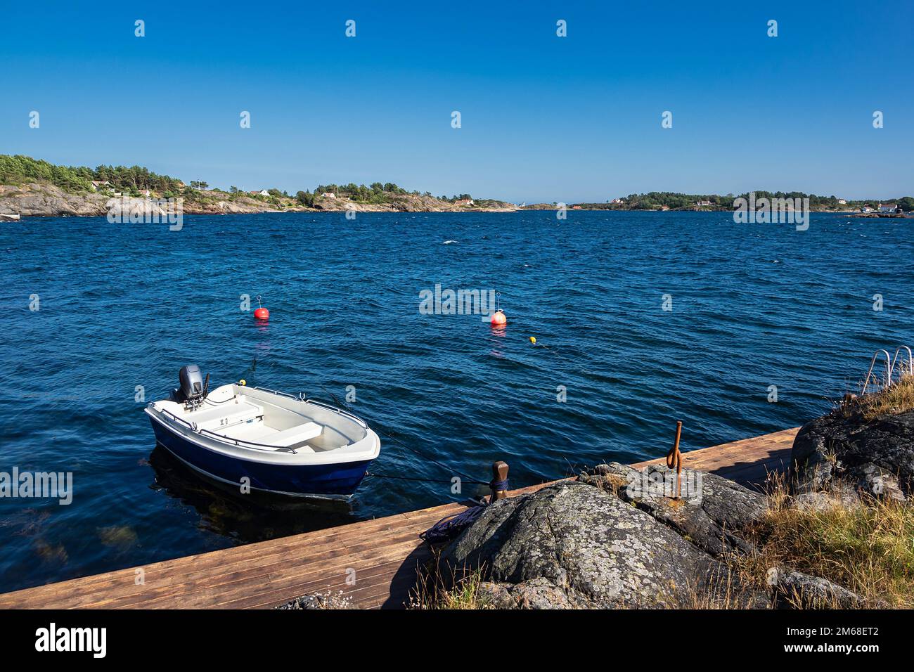 Boat And Mooring In Hamborsund In Norway. Stock Photo