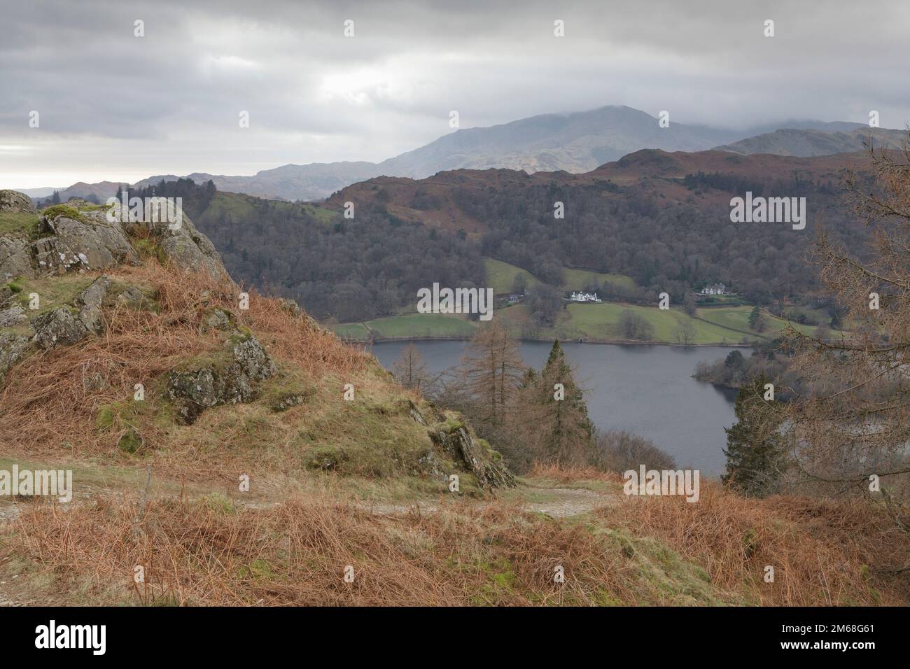 The footpath on Grey Crag leading from Alcock Tarn down to Grasmere. Lake District Stock Photo