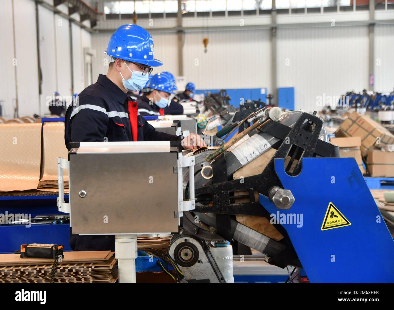HANDAN, CHINA JANUARY 3, 2023 Workers assemble transformers at a